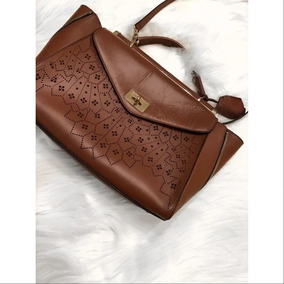 BCBGMaxAzria laser cut trapeze handbag